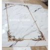 Elegant French-style marble inlay floor with white base and decorative corner tile medallions in gold and floral colors.