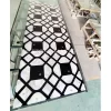 Marble inlay floor with black and white high-contrast custom marble inlay design for modern luxury interior floor applications.