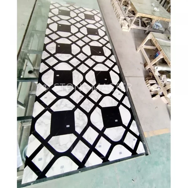 Marble inlay floor with black and white high-contrast custom marble inlay design for modern luxury interior floor applications.